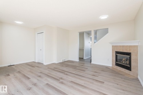 2912 31 Street, Edmonton, AB - Indoor Photo Showing Living Room With Fireplace