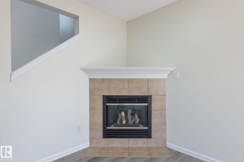 2912 31 Street, Edmonton, AB - Indoor Photo Showing Living Room With Fireplace