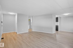 Empty room featuring light wood finished floors - 