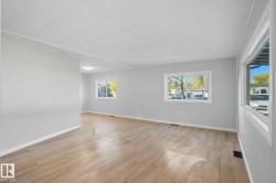 Empty room featuring light wood-style flooring and baseboards - 