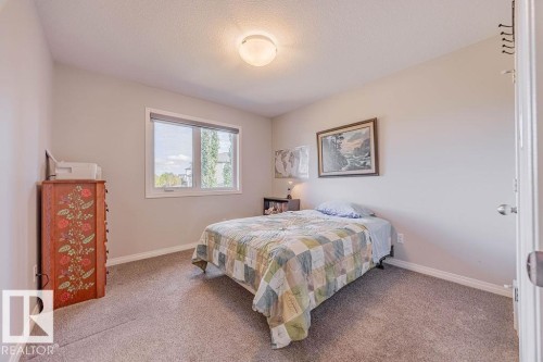 1019 Coopers Hawk Link, Edmonton, AB - Indoor Photo Showing Bedroom