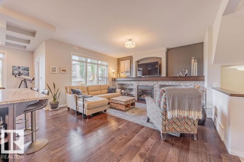 1019 Coopers Hawk Link, Edmonton, AB - Indoor Photo Showing Living Room With Fireplace