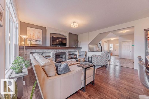 1019 Coopers Hawk Link, Edmonton, AB - Indoor Photo Showing Living Room With Fireplace