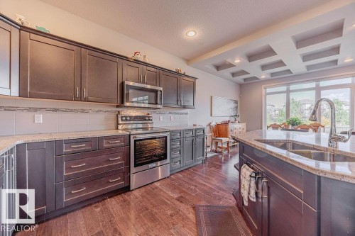 1019 Coopers Hawk Link, Edmonton, AB - Indoor Photo Showing Kitchen With Double Sink