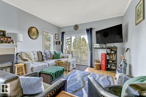 33C 79 Bellerose Drive, St. Albert, AB - Indoor Photo Showing Living Room With Fireplace