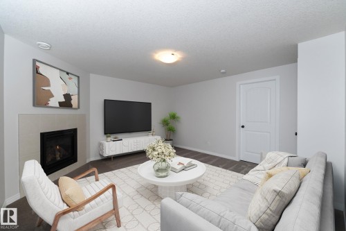 197 Birchwood Close, Devon, AB - Indoor Photo Showing Living Room With Fireplace