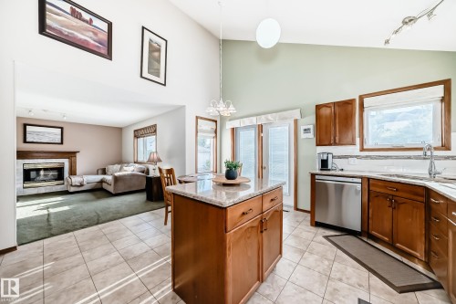 15815 63 Street, Edmonton, AB - Indoor Photo Showing Kitchen With Fireplace With Double Sink