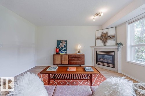 102 9008 99 Avenue, Edmonton, AB - Indoor Photo Showing Living Room With Fireplace