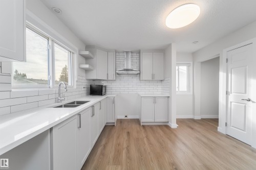 7115 12 Avenue, Edmonton, AB - Indoor Photo Showing Kitchen With Double Sink