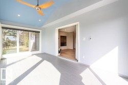 Unfurnished room with recessed lighting, lofted ceiling, a ceiling fan, and light wood-type flooring - 