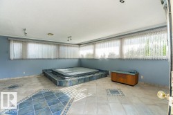 View of pool with a sunroom - 