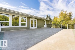 Back of property featuring french doors and a patio - 