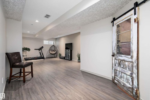 135 Gilmore Way, Spruce Grove, AB - Indoor Photo Showing Gym Room