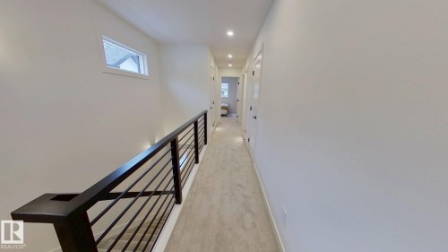 Hall with light carpet and recessed lighting - 11308 128 Street, Edmonton, AB - Indoor Photo Showing Other Room