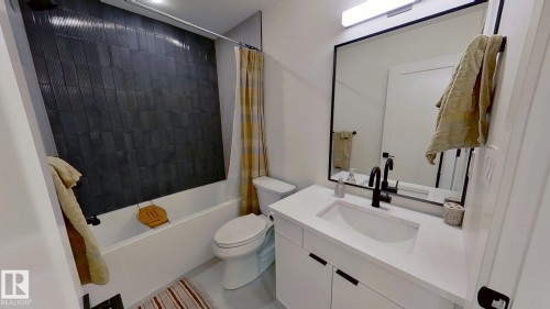 Bathroom featuring shower / tub combo with curtain and vanity - 11308 128 Street, Edmonton, AB - Indoor Photo Showing Bathroom