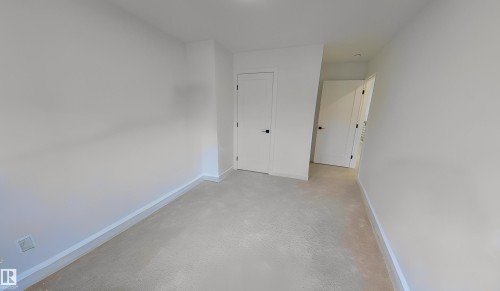 Hall with baseboards - 11308 128 Street, Edmonton, AB - Indoor Photo Showing Other Room
