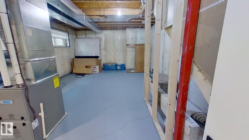 Below grade area featuring heating unit - 11308 128 Street, Edmonton, AB - Indoor Photo Showing Basement