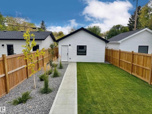 Back of property with a fenced backyard and an outbuilding - 11308 128 Street, Edmonton, AB - Outdoor With Exterior