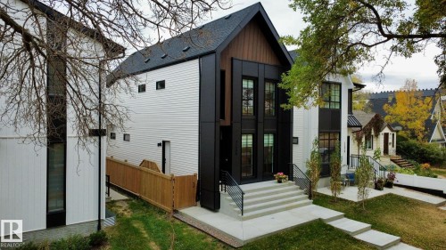 Back of property with a shingled roof and a lawn - 11308 128 Street, Edmonton, AB - Outdoor