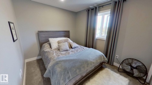 Carpeted bedroom with baseboards - 8809 148 Street, Edmonton, AB - Indoor Photo Showing Bedroom