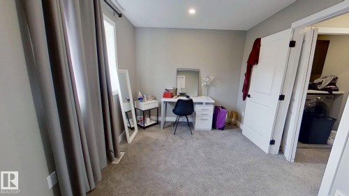 Office with light colored carpet and washer / clothes dryer - 8809 148 Street, Edmonton, AB - Indoor Photo Showing Other Room