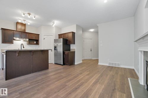 2209 Austin Way, Edmonton, AB - Indoor Photo Showing Kitchen With Fireplace