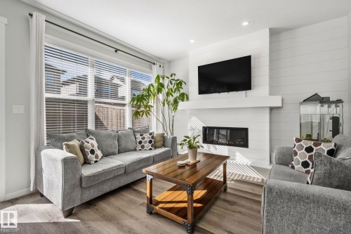 1093 Secord Promenade, Edmonton, AB - Indoor Photo Showing Living Room With Fireplace