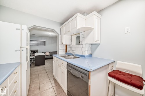 11951 77 Street Nw, Edmonton, AB - Indoor Photo Showing Kitchen With Double Sink