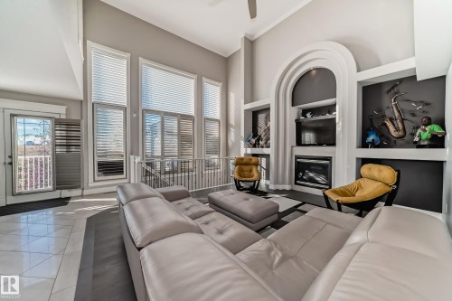 Edmonton, AB - Indoor Photo Showing Living Room With Fireplace