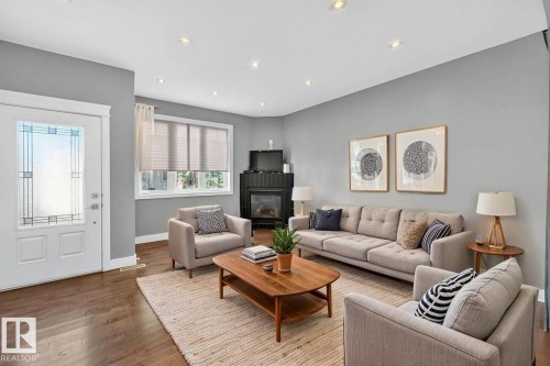 7909 105 Avenue Nw, Edmonton, AB - Indoor Photo Showing Living Room With Fireplace