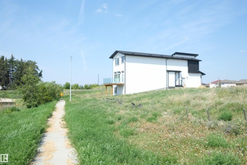 View of home's exterior with stucco siding - 9227 156 Avenue, Edmonton, AB 