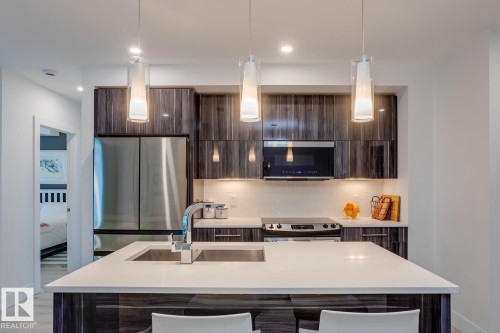 206 11969 Jasper Avenue, Edmonton, AB - Indoor Photo Showing Kitchen With Upgraded Kitchen