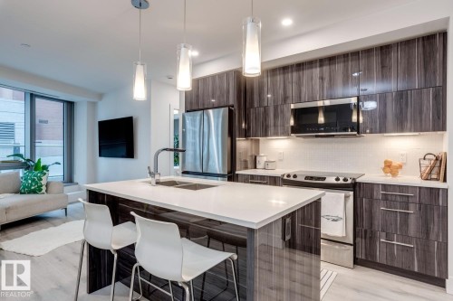 206 11969 Jasper Avenue, Edmonton, AB - Indoor Photo Showing Kitchen With Double Sink With Upgraded Kitchen