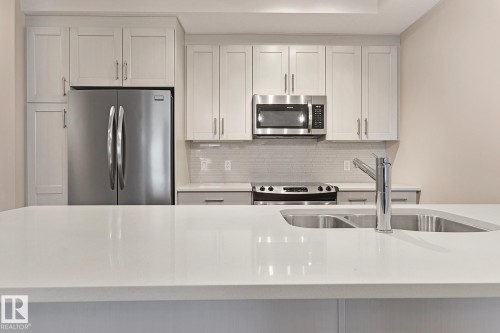 404 625 Leger Way, Edmonton, AB - Indoor Photo Showing Kitchen With Double Sink With Upgraded Kitchen