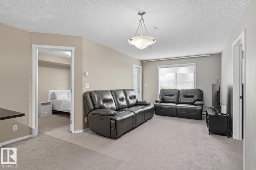 205 5810 Mullen Place, Edmonton, AB - Indoor Photo Showing Living Room