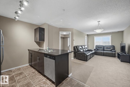 205 5810 Mullen Place, Edmonton, AB - Indoor Photo Showing Kitchen With Double Sink