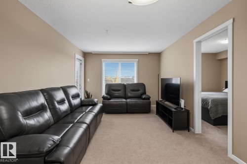 205 5810 Mullen Place, Edmonton, AB - Indoor Photo Showing Living Room