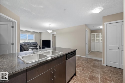 205 5810 Mullen Place, Edmonton, AB - Indoor Photo Showing Kitchen With Double Sink
