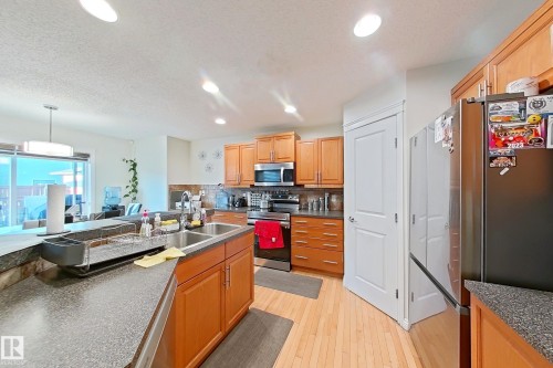 3008 24 Avenue, Edmonton, AB - Indoor Photo Showing Kitchen With Double Sink