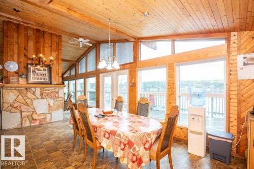 16 Maple Cresent, Rural Westlock County, AB - Indoor Photo Showing Dining Room With Fireplace