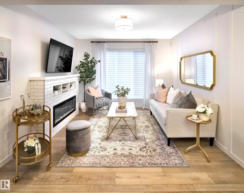 37 1025 Secord Promenade, Edmonton, AB - Indoor Photo Showing Living Room With Fireplace