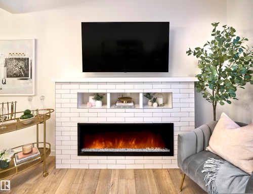37 1025 Secord Promenade, Edmonton, AB - Indoor Photo Showing Living Room With Fireplace