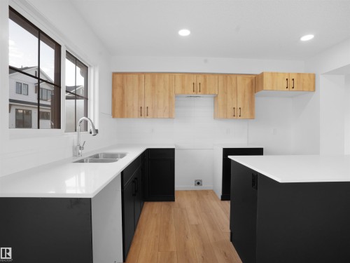 62 525 Secord Boulevard, Edmonton, AB - Indoor Photo Showing Kitchen With Double Sink