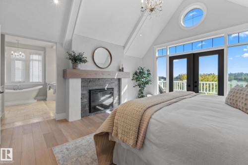 1020 Genesis Lake Boulevard, Stony Plain, AB - Indoor Photo Showing Bedroom With Fireplace