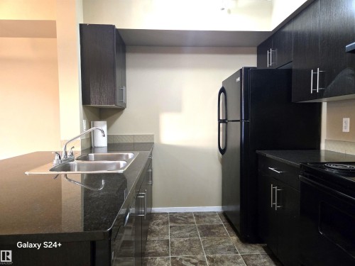 210 3207 James Mowatt Trail, Edmonton, AB - Indoor Photo Showing Kitchen With Double Sink