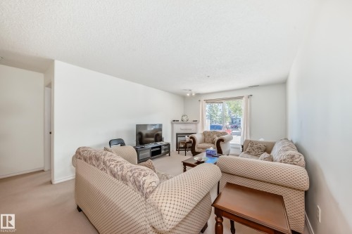 134 16311 95 Street, Edmonton, AB - Indoor Photo Showing Living Room With Fireplace