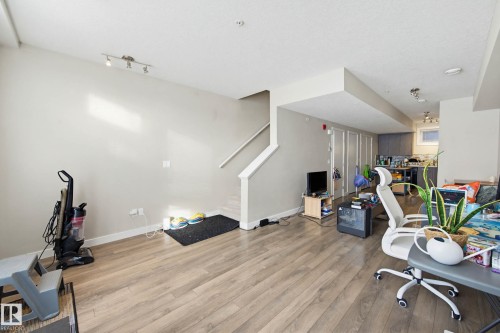 Office with wood finished floors and baseboards - 90 2560 Pegasus Boulevard, Edmonton, AB - Indoor