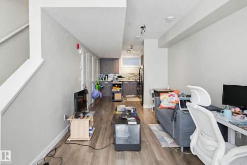 Office space featuring wood finished floors and baseboards - 90 2560 Pegasus Boulevard, Edmonton, AB - Indoor