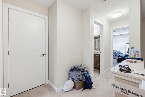 Hall featuring light colored carpet and baseboards - 90 2560 Pegasus Boulevard, Edmonton, AB - Indoor Photo Showing Other Room