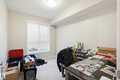 Carpeted home office with a textured ceiling and baseboards - 90 2560 Pegasus Boulevard, Edmonton, AB - Indoor